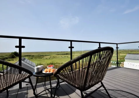 The balcony & outdoor sitting area at Sandy Toes, Westward Ho!