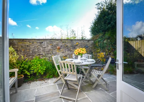 The patio, barbecue & alfresco dining area at School Cottage, Little Petherick