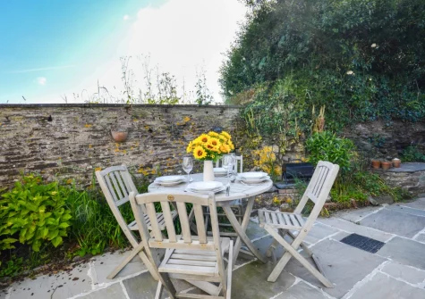 The patio, barbecue & alfresco dining area at School Cottage, Little Petherick