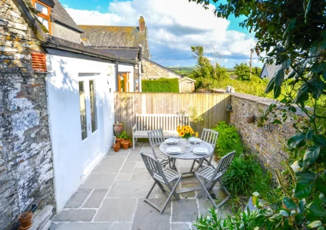 The patio, barbecue & alfresco dining area at School Cottage, Little Petherick