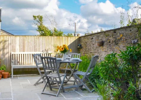 The patio, barbecue & alfresco dining area at School Cottage, Little Petherick