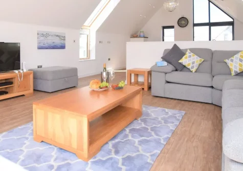 Sea Breeze, Westward Ho! is a luxurious three-bedroom retreat with a private hot tub and modern amenities just moments from golden sands. Featuring smart TVs, a Nintendo Wii and an outdoor entertainment space, it's perfect for family holidays.