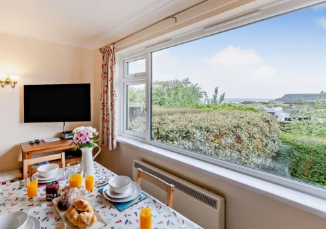 The living & dining area at Sea Escape, Widemouth Bay