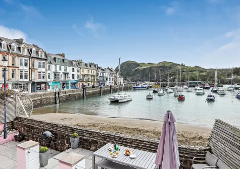 The patio, barbecue & alfresco dining area at Sea Foam House, Ilfracombe