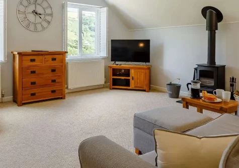 Sea Glimpse, Seaton is a spacious three-storey beach house with elevated gardens, games room, and wood burner. Perfect for families seeking a memorable Cornish coastal retreat with stunning sea glimpses and convenient beach access nearby.