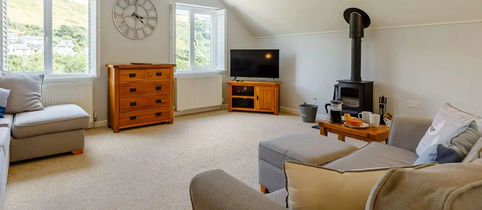 Sea Glimpse, Seaton is a spacious three-storey beach house with elevated gardens, games room, and wood burner. Perfect for families seeking a memorable Cornish coastal retreat with stunning sea glimpses and convenient beach access nearby.