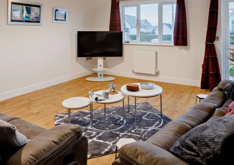 Sea Haze Number 6, Westward Ho! is a spacious single-storey bungalow built in 2022, just a level walk from the village's famous two-mile sandy beach, featuring contemporary interiors, enclosed garden with country park views, and games room fun.