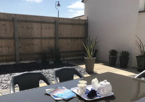 The enclosed garden patio & alfresco dining area at Sea Pink Cottage, Newquay
