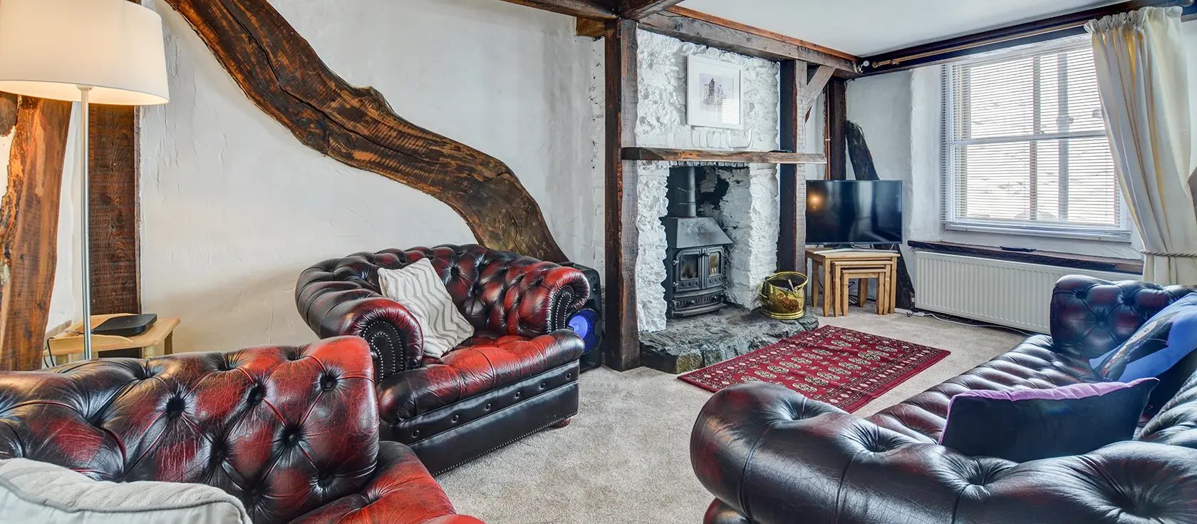 Sea Reach, Looe is a charming 400-year-old fisherman's cottage in the heart of Cornwall's beloved fishing town. Enjoy exposed beams, an inglenook fireplace, and authentic maritime character just metres from the harbour and sandy beaches.