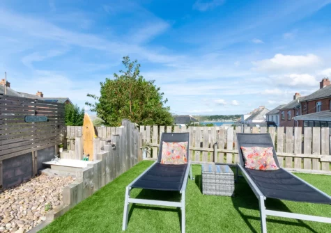 The lawn with sun loungers at Sea Renity, Padstow