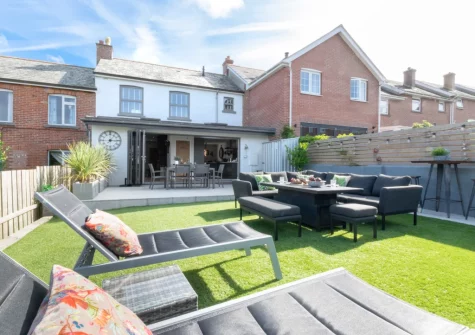 The lawn with sun loungers & outdoor sitting area at Sea Renity, Padstow