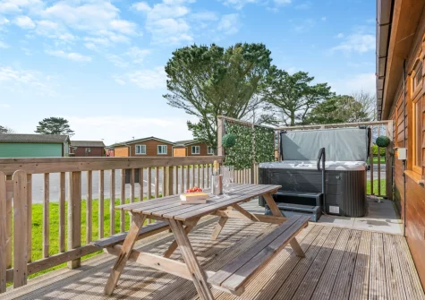 The decked terrace, alfresco dining area & hot tub at Seabreeze Retreat, St Merryn