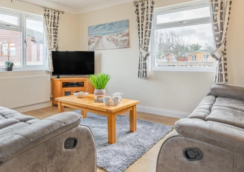 Seabreeze Retreat, St Merryn is a spacious three-bedroom, single-storey lodge on Cornwall's north coast, featuring a private hot tub on the deck, flexible sleeping for families, and stunning beaches including Treyarnon Bay just moments away.