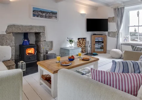 Seahorse Cottage, Mousehole is a luxurious 2-bedroom coastal retreat with stunning harbour views, contemporary interiors, and a sun-drenched courtyard garden. Perfect for families or couples seeking authentic Cornish charm and seaside memories.