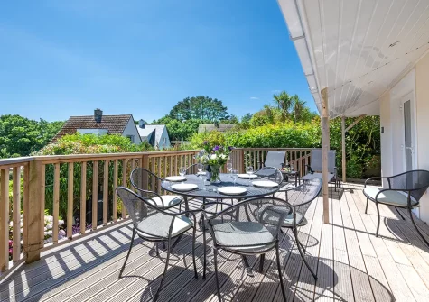 The decked patio, alfresco dining & outdoor sitting area at Seahorses, Fowey