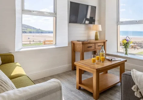 Sealawn, Croyde is a stunning beachfront apartment with direct beach access, panoramic sea views, and flexible sleeping for six guests. Perfect for families seeking an authentic North Devon coastal experience in this renowned surfing village.