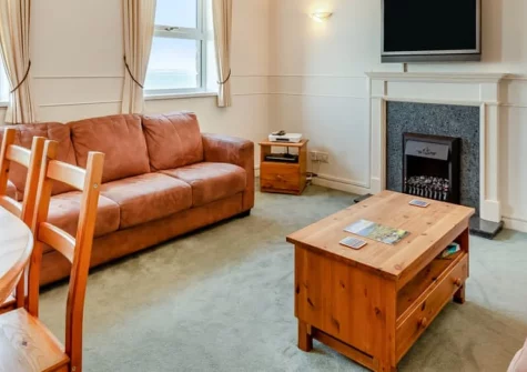 Seascape, Porthleven is a beautifully appointed three-bedroom cottage with reverse-level living, spectacular Mounts Bay views, a games room, a terraced garden, and private parking, all positioned right on the South West Coast Path.