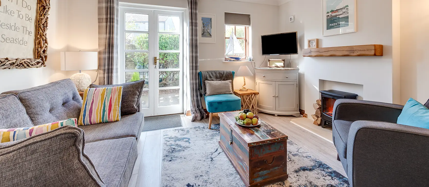 Seashells, Padstow is a stylish two-bedroom cottage just steps from the historic harbour. Enjoy multiple sun-soaked gardens, contemporary coastal décor, and easy access to North Cornwall's beaches and attractions for memorable holidays.