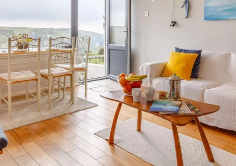 Seaspray Cottage, Mullion Cove is a charming two-bedroom coastal retreat perched above a picture-perfect harbour cove, with stunning sea views, a private terrace, a BBQ, and easy access to Cornwall's beaches, cliffs, and heritage attractions.