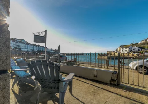 The enclosed paved terrace & outdoor sitting area at Seaview Moorings, Porthleven