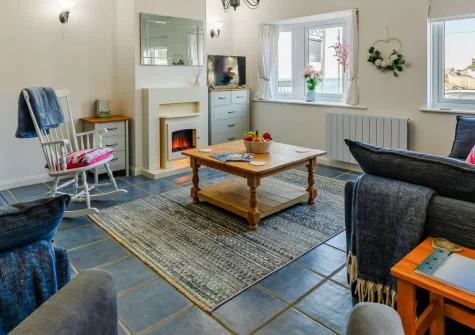 Seaview Moorings, Porthleven is a charming two-bedroom cottage in the heart of this celebrated coastal village, featuring beautiful harbour and sea views, coastal-style interiors, and Porthleven's galleries, beaches and eateries just steps away.