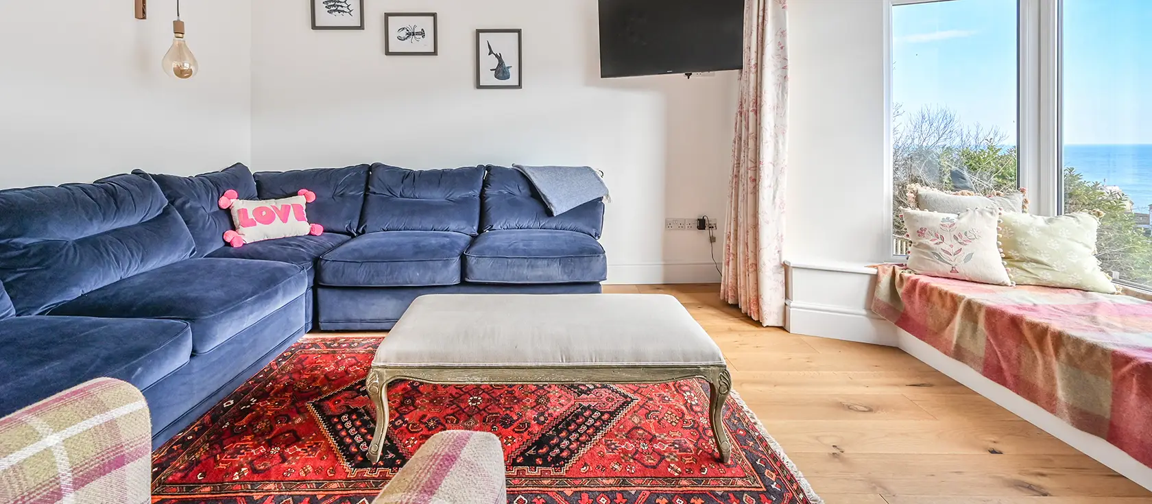 Seawind, Looe is a stunning three-bedroom coastal retreat with breathtaking harbour views and stylish interiors. Enjoy a private decked terrace with BBQ, steps from the sandy beach, perfect for unforgettable family escapes in Cornwall.