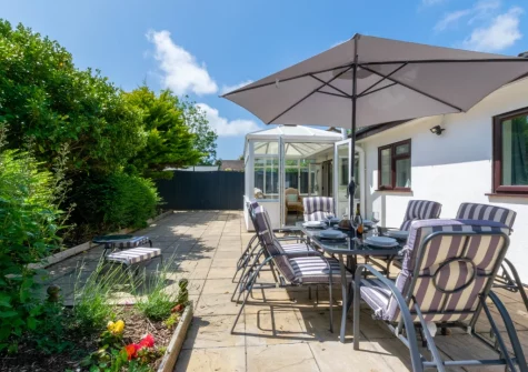 The garden patio & alfresco dining area at Shellseekers, Tregolds