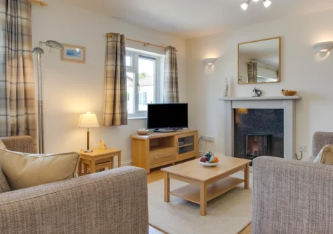 Shellseekers, Tregolds is a charming detached bungalow in peaceful surroundings near St Merryn, featuring a bright conservatory, enclosed patio garden, stylish coastal interiors, and easy access to North Cornwall's most beautiful beaches.