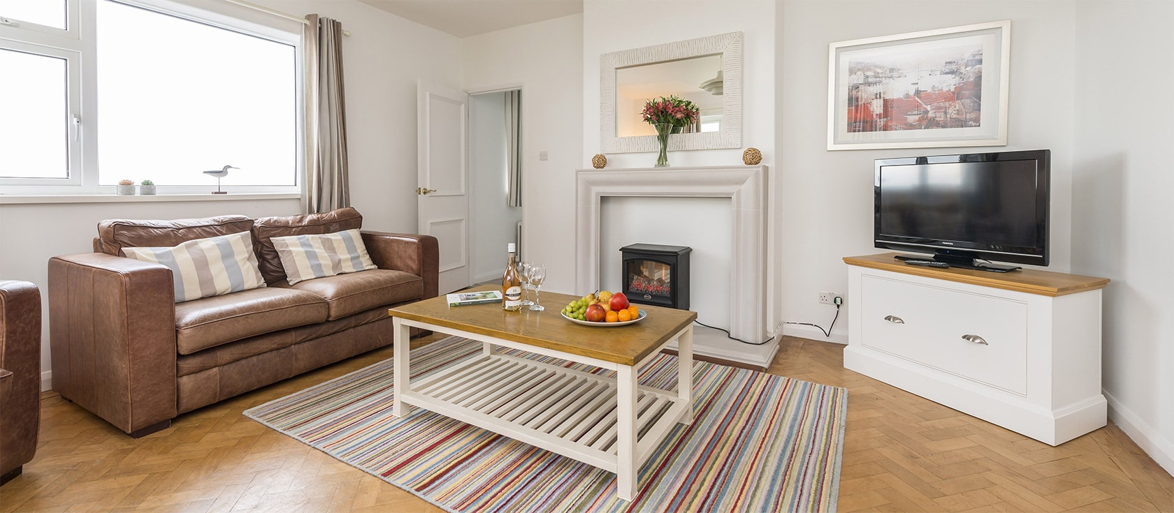 Sherrin, Bull Point Lighthouse, Mortehoe is a modern three bedroom bungalow for five surrounded by panoramic coastal views. Spacious accommodation is modern and comfortable with a cosy electric woodburner. Ample parking and walks to beaches on the doorstep.