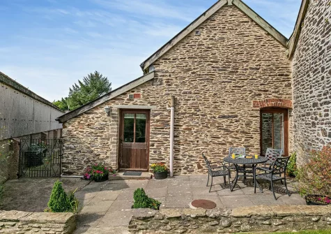 The patio & alfresco dining area at Shirleys Cottage, Bentwitchen