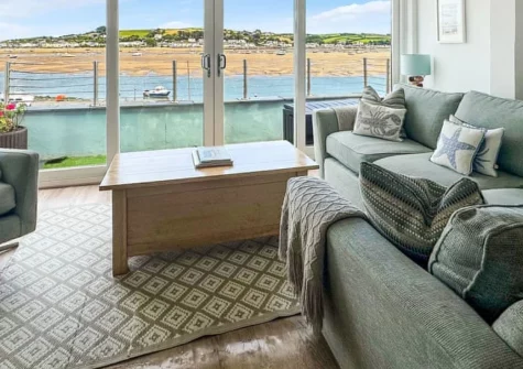 Shorewaters, Appledore is a beautifully renovated three-bedroom cottage on the Torridge Estuary, featuring a spectacular roof terrace with river views, two balconies perfect for boat watching, and contemporary interiors steps from the quay.
