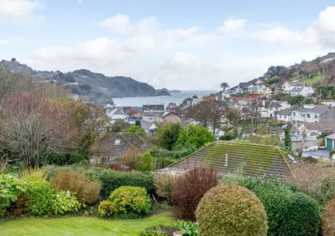 The view from the decked patio, alfresco dining area & garden at Silver Seas, Combe Martin