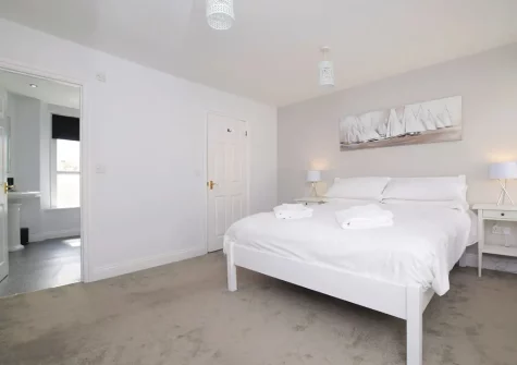 Bedroom #1 & en-suite shower room at Skippers Cottage, Brixham