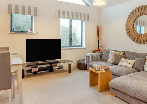 Slipway, Fowey is a stylish, contemporaray two-bedroom riverside apartment with lift access and estuary views, positioned moments from the Bodinnick Ferry crossing and Fowey's charming harbour, independent shops, and waterside dining.
