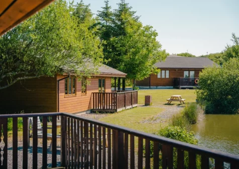 The decked balcony is an ideal setting for alfresco dining, or watching the sun set over the lake