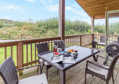 The decked terrace, barbecue & alfresco dining area at Snowy Owl, Winnard's Perch
