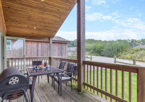 The decked terrace, barbecue & alfresco dining area at Snowy Owl, Winnard's Perch