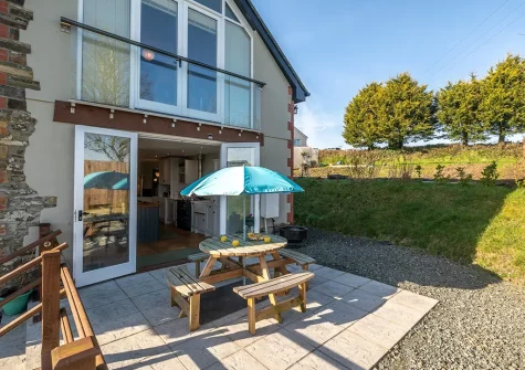 The patio, barbecue & alfresco dining area at South Woodford, Milton Damerel