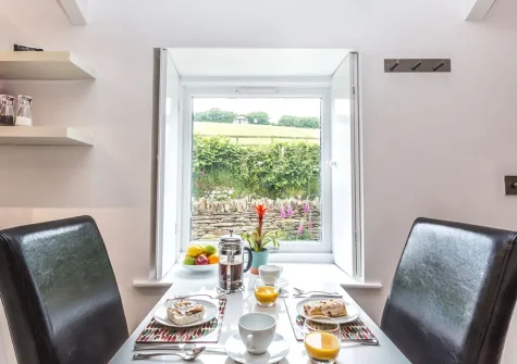 The dining area at Spice Barn, Old Lanwarnick Cottages, Trefanny Hill