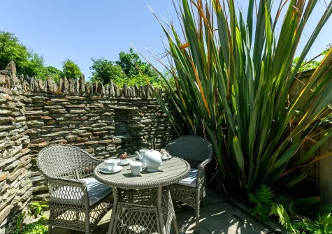 The patio & alfresco dining area at Spice Barn, Old Lanwarnick Cottages, Trefanny Hill