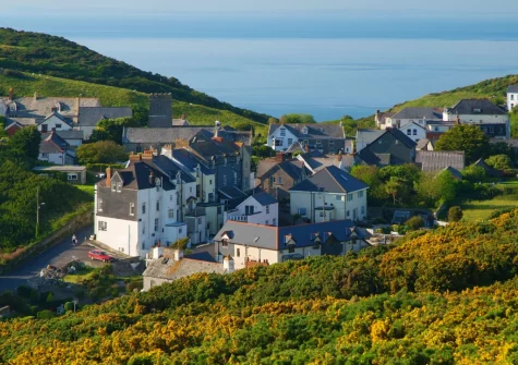 Mortehoe, a small picturesque hilltop village is known for its old-world charm, historic slate-hung cottages, and dramatic coastal scenery on the South West Coast Path.