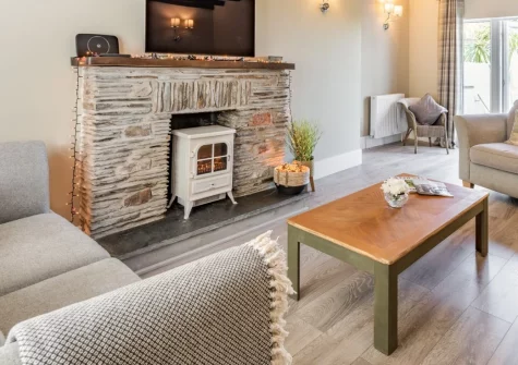 Spring Cottage, Mortehoe is a stunning three-storey retreat in a charming North Devon village, featuring spectacular Bristol Channel views from multiple rooms, original oak beams, and direct access to the South West Coast Path just 20 metres away.