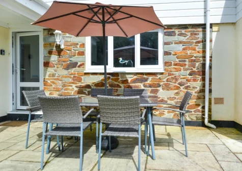 The patio & alfresco dining area at St Mellyn, Portmellon