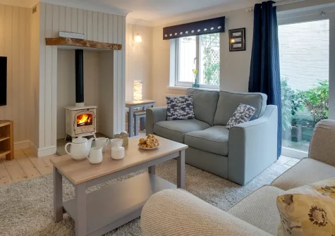 St Mellyn, Portmellon is a spacious eight-bedroom family home with premium comfort and coastal charm. Beautiful gardens, wood burners, and direct beach access create the perfect setting for unforgettable family holidays and cherished memories.