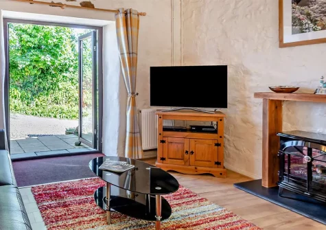 Stable Farm Cottage, Bush is a characterful three-bedroom retreat within Trevalgas Cottages, with exposed beams, enclosed gardens, and access to onsite leisure facilities including a heated indoor pool, perfect for families seeking a coastal escape.