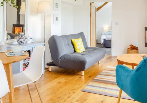 Standing Stones, Newlyn is a romantic converted stable in the heart of West Cornwall, featuring a wood-fired hot tub, atmospheric garden with ancient granite stones, and easy access to spectacular coastline, fishing villages and beaches.