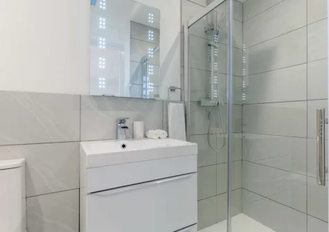 The en-suite shower room at Stargazing Cottage, St Just