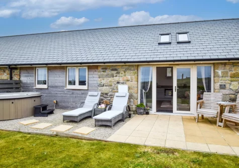 The terrace, hot tub, outdoor sitting area & enclosed gaden at Stargazing Cottage, St Just