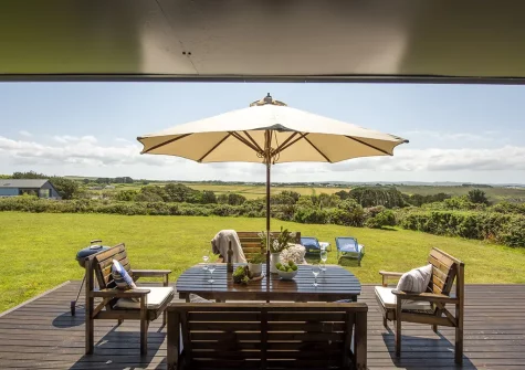The decked patio, barbecue & alfresco dining area at Stargazy, Morcliff Holiday Lodges, St Agnes