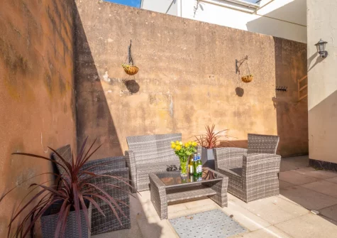 The enclosed patio & outdoor sitting area at Stepcott Cottage, Braunton